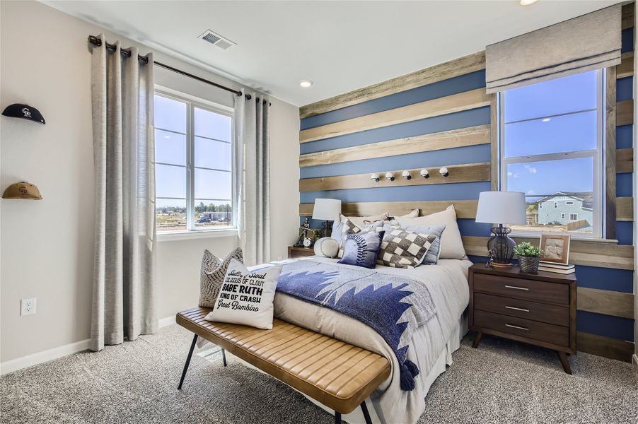 A bedroom with a bed and a bench. A bedroom with a bed and a bench.