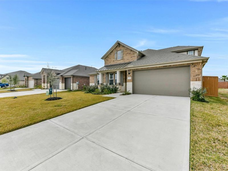 Front exterior of a new home in Lago Mar, Texas City, TX, highlighting curb appeal (Image 22). Front exterior of a new home in Lago Mar, Texas City, TX, highlighting curb appeal (Image 22).