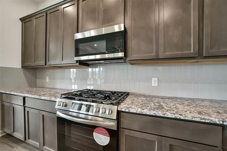 Furnished interior view inside a new home in Sunterra, Katy (Image 33).