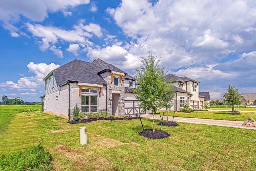 Front exterior of a new home in WaterStone, Montgomery, TX, highlighting curb appeal (Image 2). Front exterior of a new home in WaterStone, Montgomery, TX, highlighting curb appeal (Image 2).