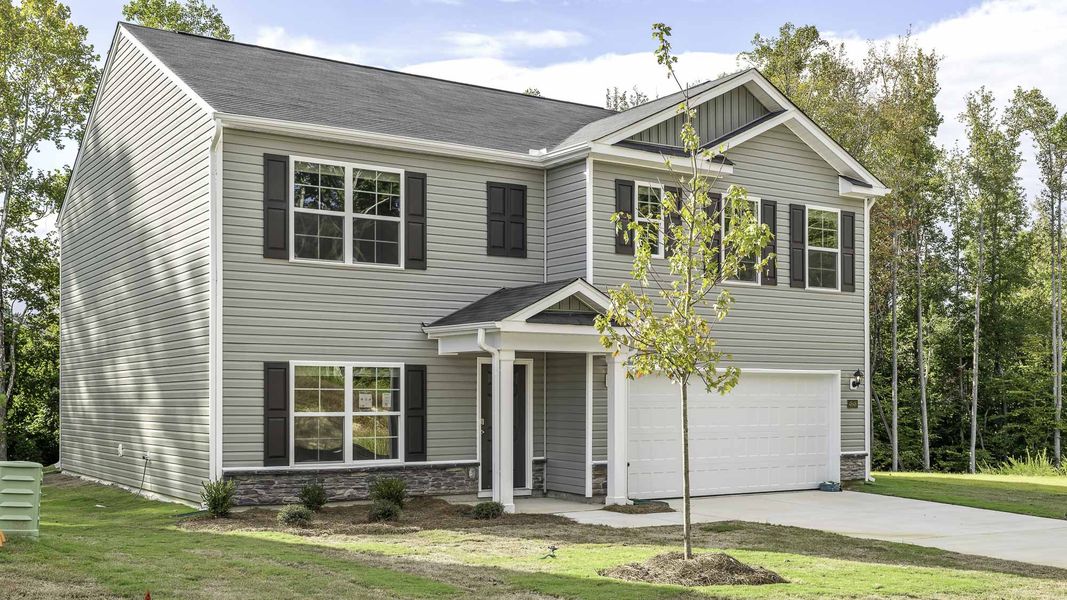 Front exterior of a new home in Mount Hope Estates, Winston-Salem, NC, highlighting curb appeal (Image 2). Front exterior of a new home in Mount Hope Estates, Winston-Salem, NC, highlighting curb appeal (Image 2).