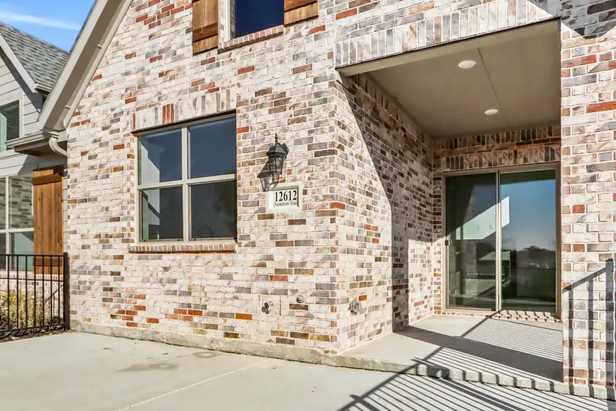 Exterior details and patio area of a home in Cottonwood Creek, Rowlett (Image 3).