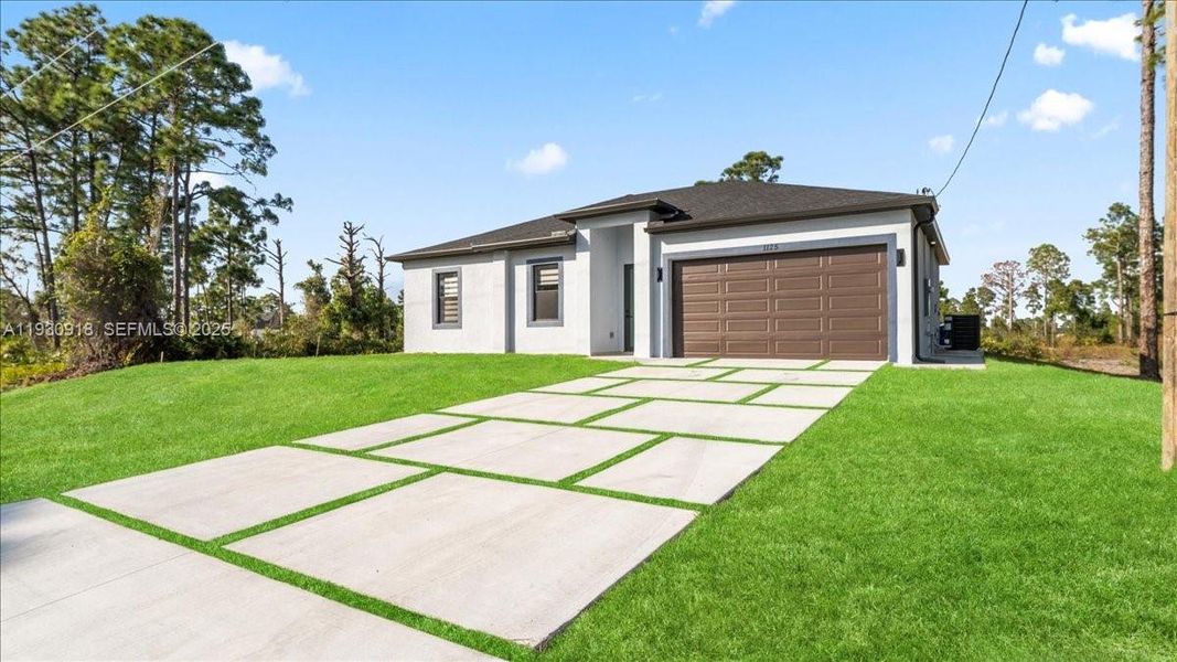 Front exterior of a new home in , Lehigh Acres, FL, highlighting curb appeal (Image 2). Front exterior of a new home in , Lehigh Acres, FL, highlighting curb appeal (Image 2).