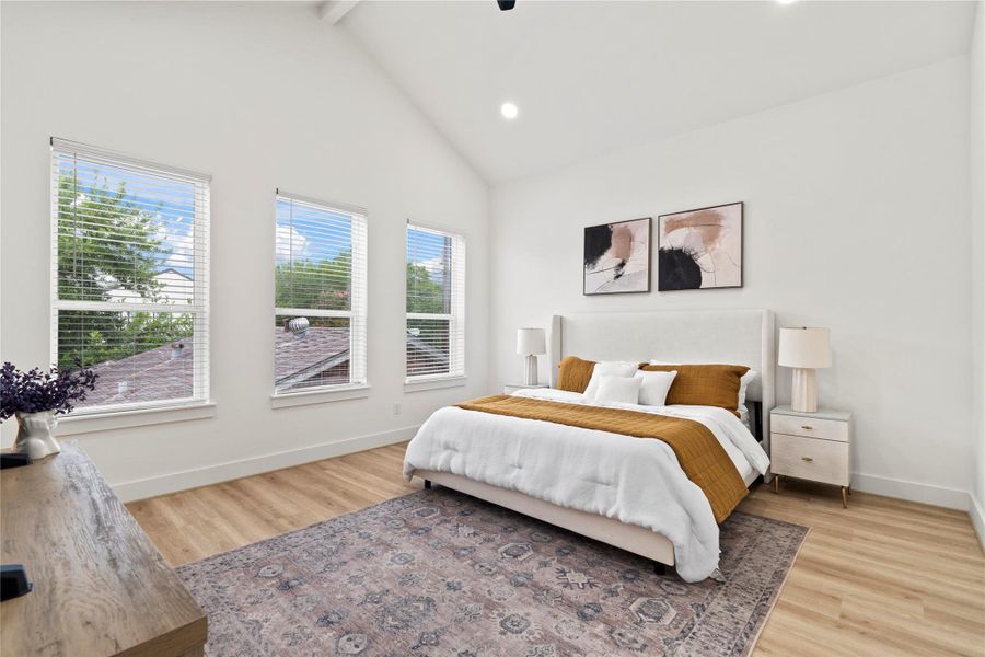 Soaring 22-foot cathedral ceilings with an exposed beam create an unforgettable primary suite moment.