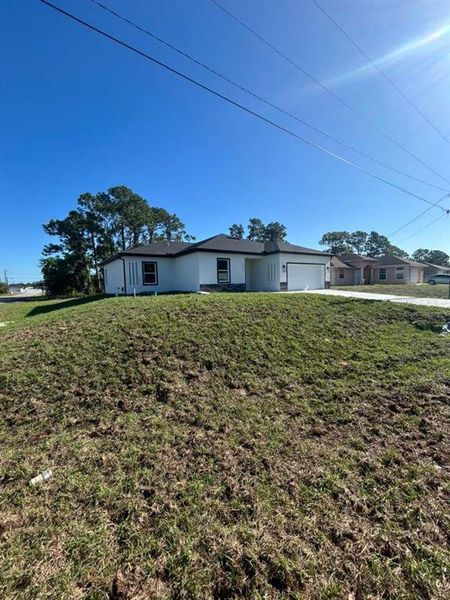 Exterior details and patio area of a home in , Lehigh Acres (Image 3).