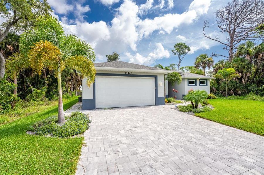 Front exterior of a new home in , Port Charlotte, FL, highlighting curb appeal (Image 1). Front exterior of a new home in , Port Charlotte, FL, highlighting curb appeal (Image 1).