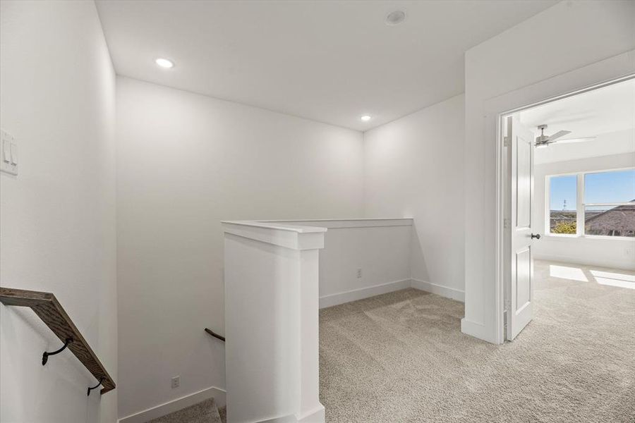 The loft at the top of the stairs makes a perfect pocket office or reading nook.