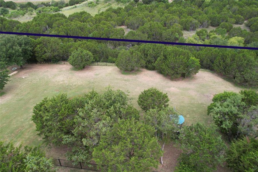 There is a second fence (below the blue line) that marks the area where the rocky edge is steep, there are stone stairs that lead down into the creek so you can go exploring