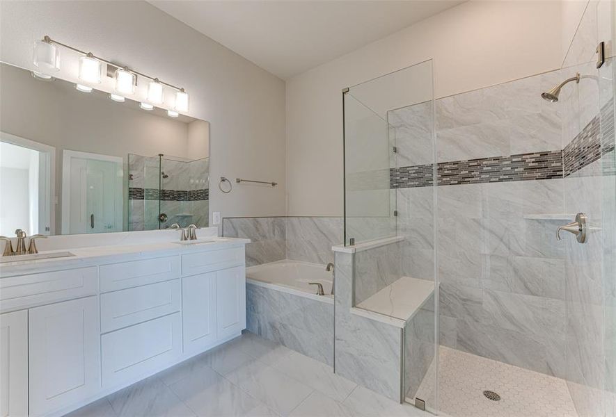 Bathroom with vanity and separate shower and tub