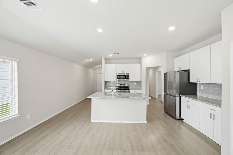 Spacious layout and seamless flow into the living and dining areas. Designed for easy living and effortless entertaining.