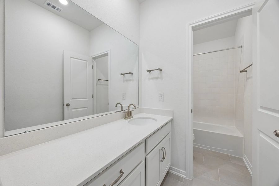 Secondary bathroom. Sample product photo. Actual exterior and interior selections may vary by homesite. Photo may be virtually staged.