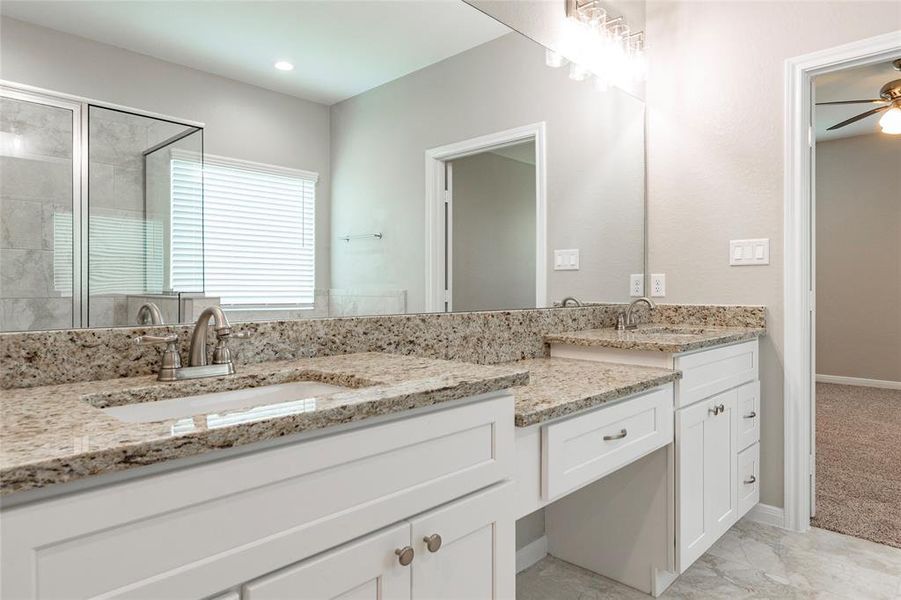 Double sinks, soft close doors and drawers and granite countertops