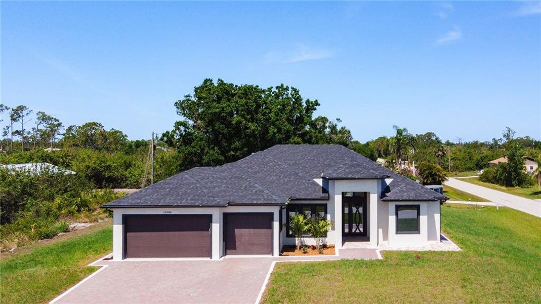 Front exterior of a new home in , Englewood, FL, highlighting curb appeal (Image 13).