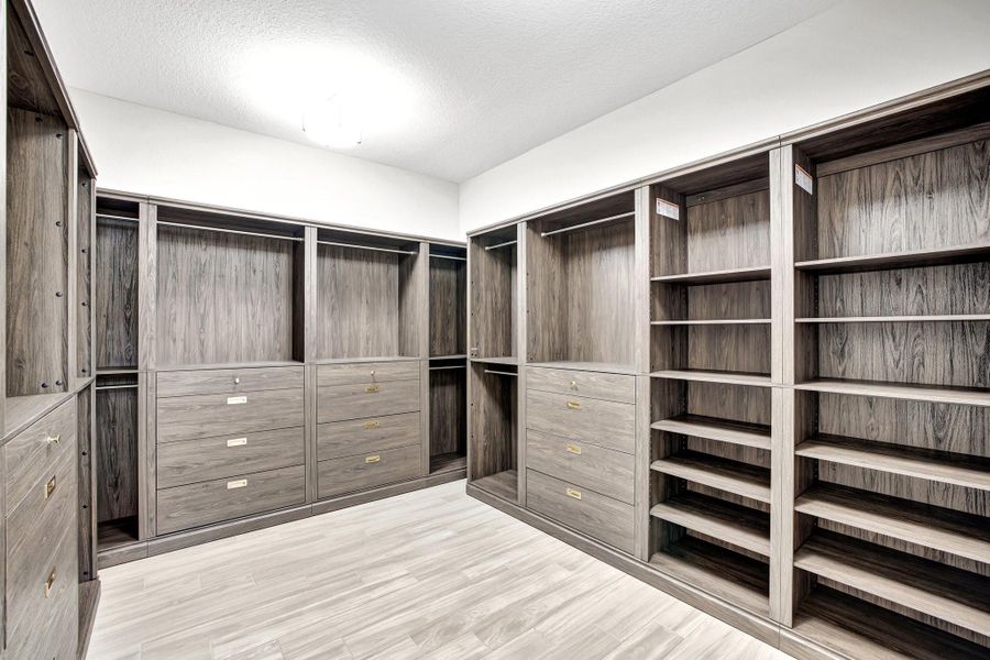 Primary closet with Scott Living custom shelving