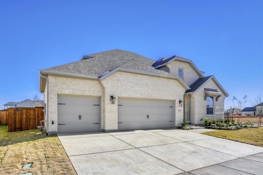 Front exterior of a new home in Ten Mile Creek, Celina, TX, highlighting curb appeal (Image 2).
