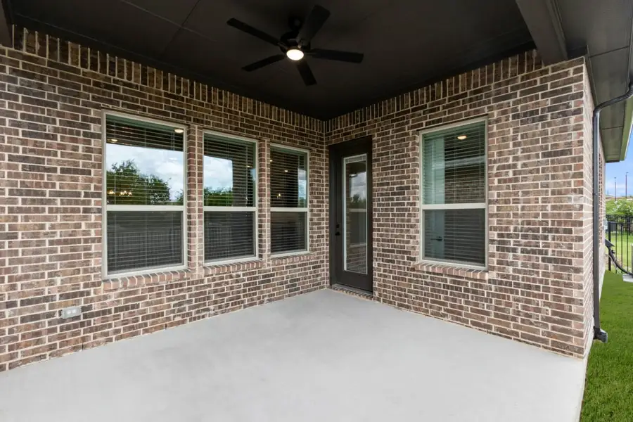 Exterior details and patio area of a home in Ladera at Tavolo Park, Fort Worth (Image 3).