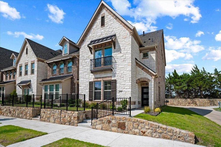 Front exterior of a new home in Bayside, Rowlett, TX, highlighting curb appeal (Image 23). Front exterior of a new home in Bayside, Rowlett, TX, highlighting curb appeal (Image 23).