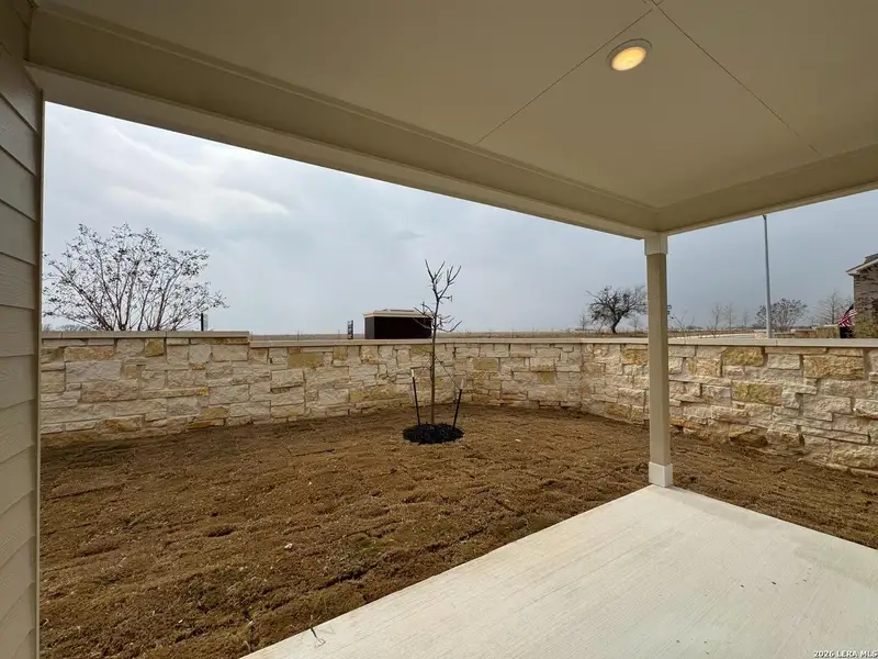 Exterior details and patio area of a home in Hennersby Hollow, San Antonio (Image 3).