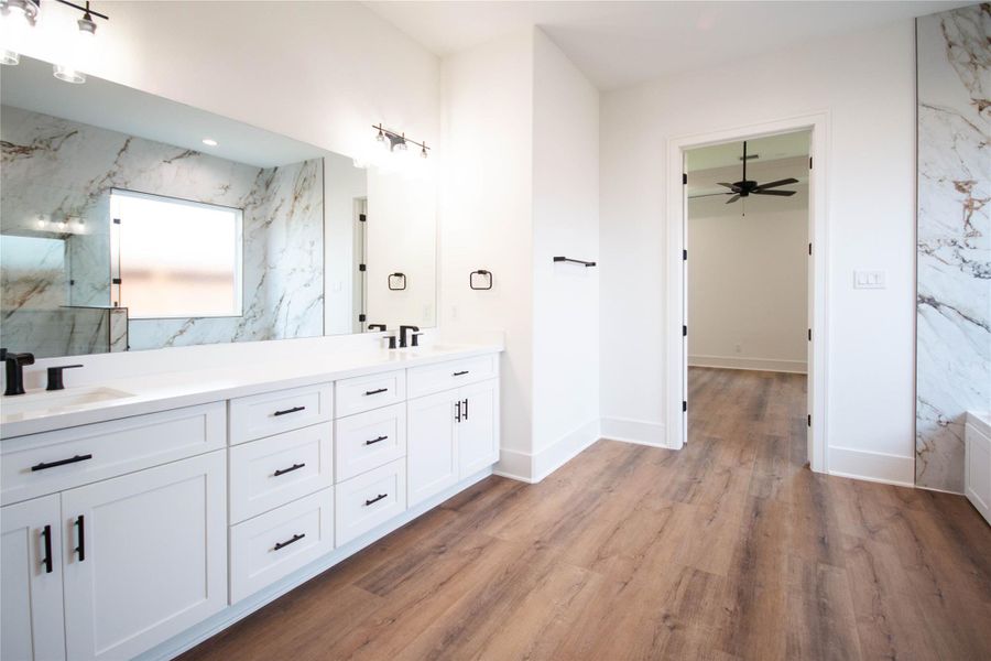 Step into the primary bath, where you'll find double sinks, abundant cabinet space, and a spacious layout of 13x14. It truly feels like your own personal spa retreat! Step into the primary bath, where you'll find double sinks, abundant cabinet space, and a spacious layout of 13x14. It truly feels like your own personal spa retreat!