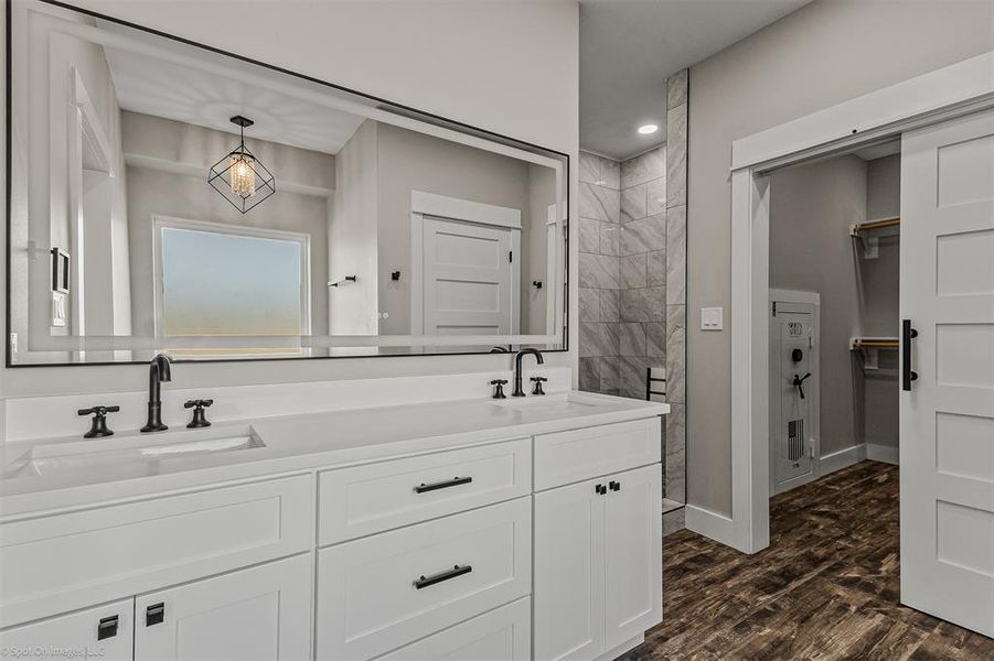 Primary Bathroom with Dual Sinks, Separate Shower and Tub, Lighted Mirror with fog control. The closet is huge with built in safe!!