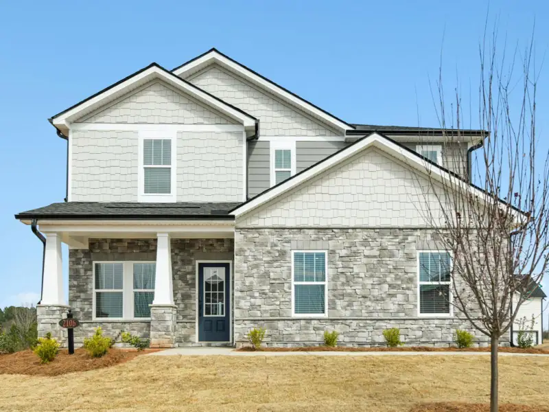 Front exterior of a new home in River Pointe, Monroe, GA, highlighting curb appeal (Image 1). Front exterior of a new home in River Pointe, Monroe, GA, highlighting curb appeal (Image 1).