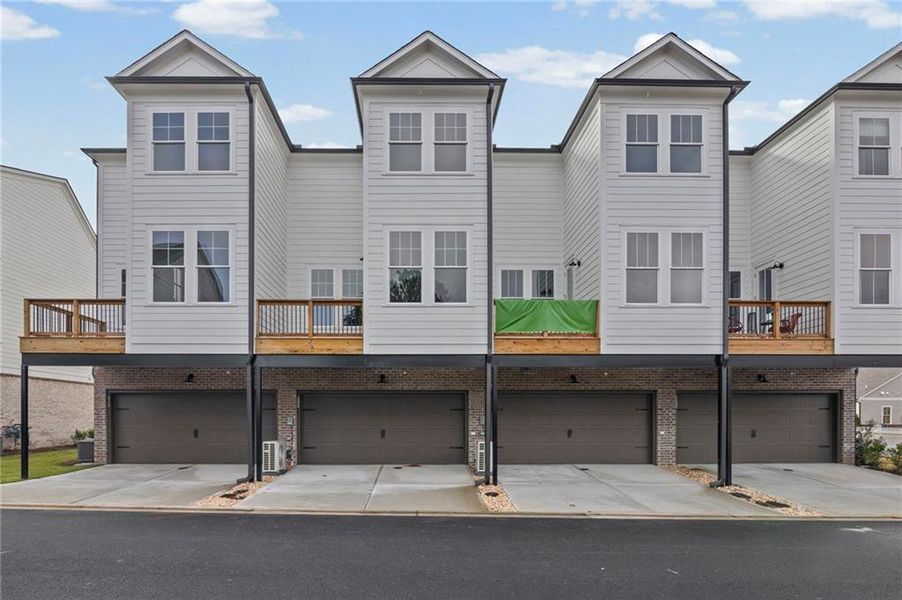 Front exterior of a new home in , Canton, GA, highlighting curb appeal (Image 2). Front exterior of a new home in , Canton, GA, highlighting curb appeal (Image 2).