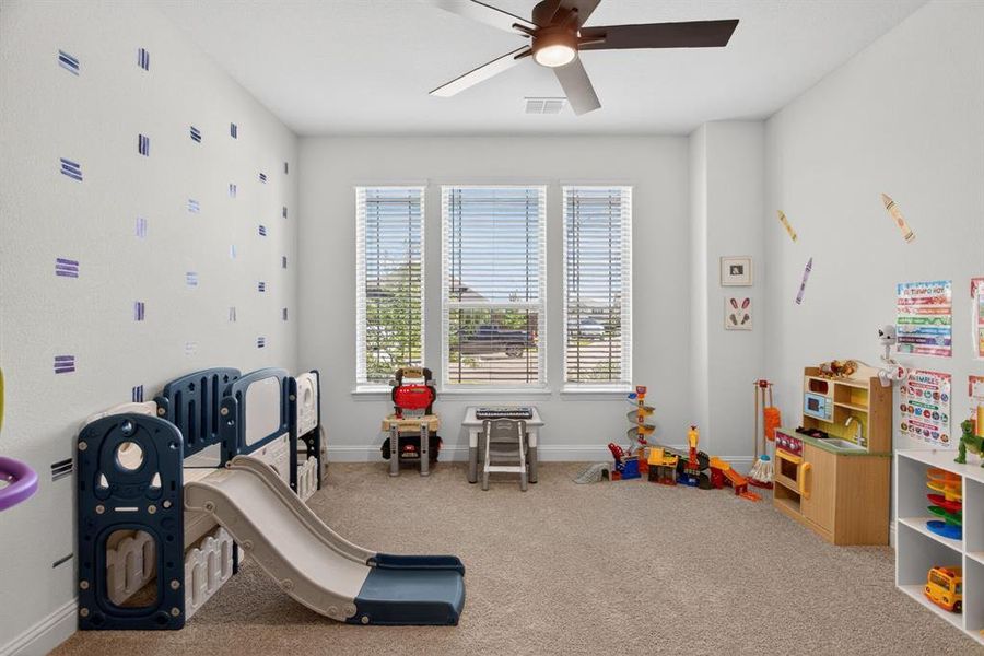 Downstairs guest bedroom is being used as a playroom; perfect for a nursery or MIL suite. Downstairs guest bedroom is being used as a playroom; perfect for a nursery or MIL suite.