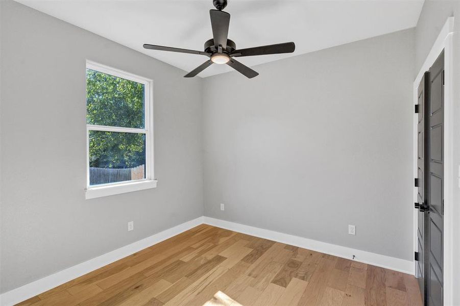 Empty room featuring light wood-type flooring and baseboards Empty room featuring light wood-type flooring and baseboards