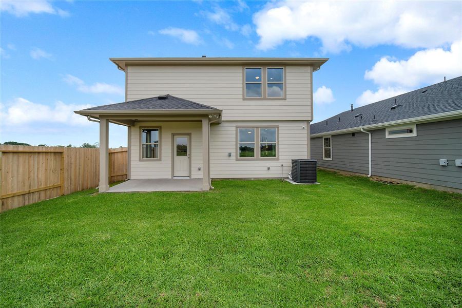 Exterior details and patio area of a home in Montgomery Ridge: Landmark Collection, Montgomery (Image 2).