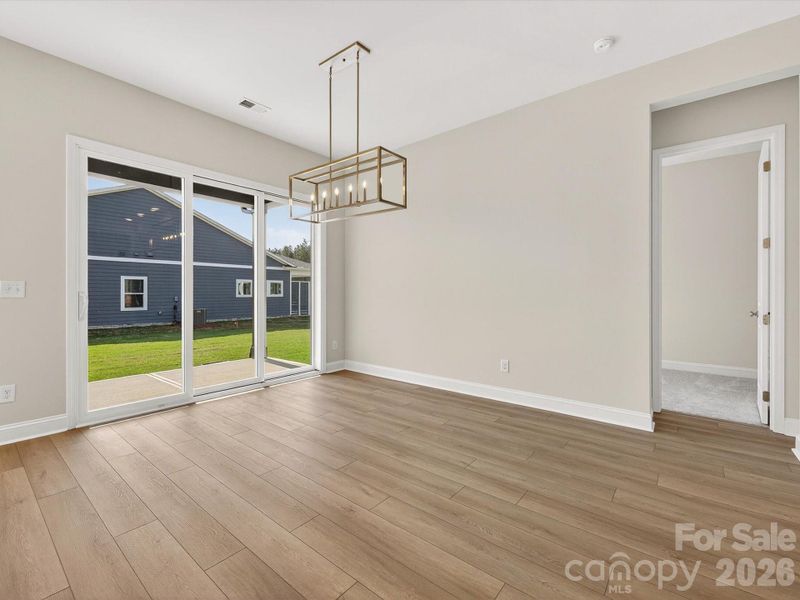 Dining space with telescopting 9 ft wide doors.