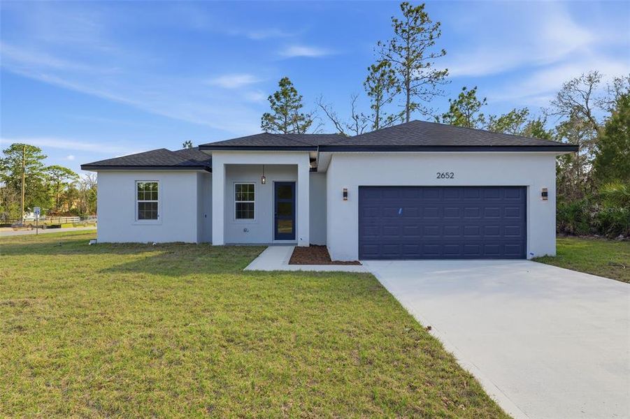 Front exterior of a new home in , Dunnellon, FL, highlighting curb appeal (Image 18).