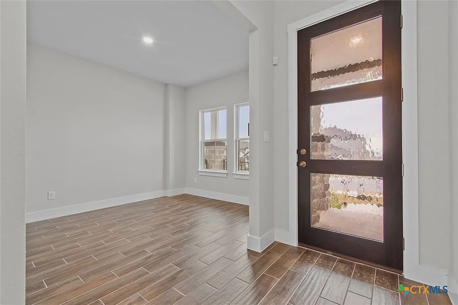 Spacious, unfurnished interior of a new home in Lakeside at Tessera on Lake Travis, Lago Vista (Image 18). Spacious, unfurnished interior of a new home in Lakeside at Tessera on Lake Travis, Lago Vista (Image 18).