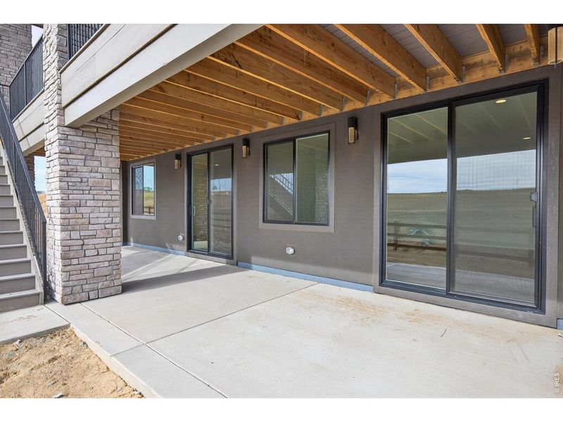 Exterior details and patio area of a home in RainDance, Windsor (Image 30).