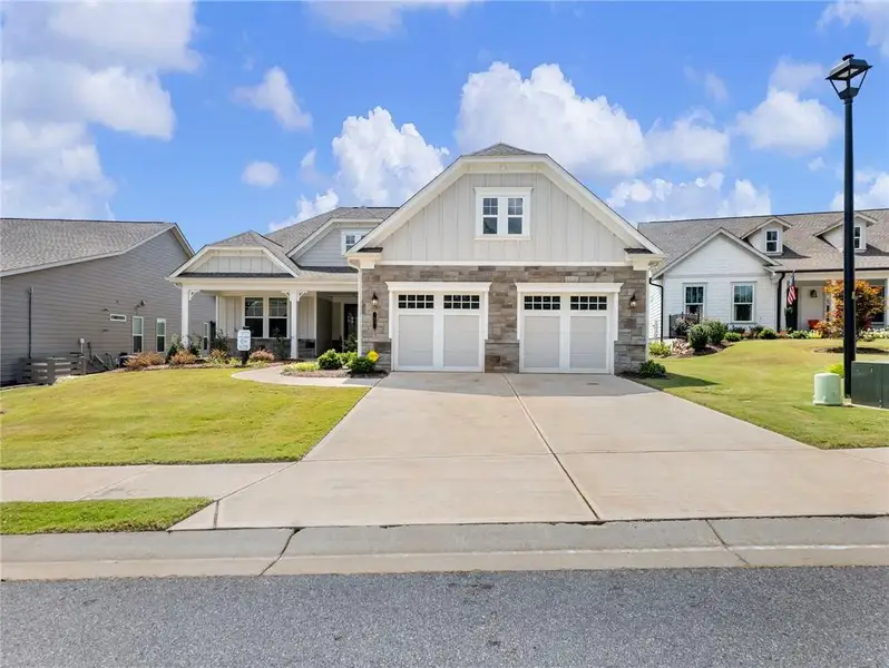 Front exterior of a new home in , Hoschton, GA, highlighting curb appeal (Image 2). Front exterior of a new home in , Hoschton, GA, highlighting curb appeal (Image 2).