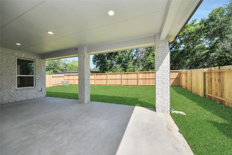 Experience outdoor living at its finest on this expansive covered patio, thoughtfully designed for BBQs and delightful outdoor dining.