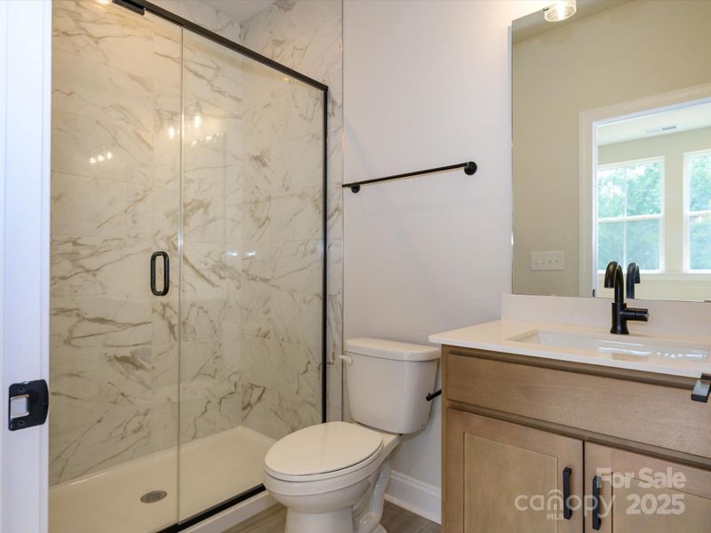 First Floor Full Bathroom with Walk-In Shower.