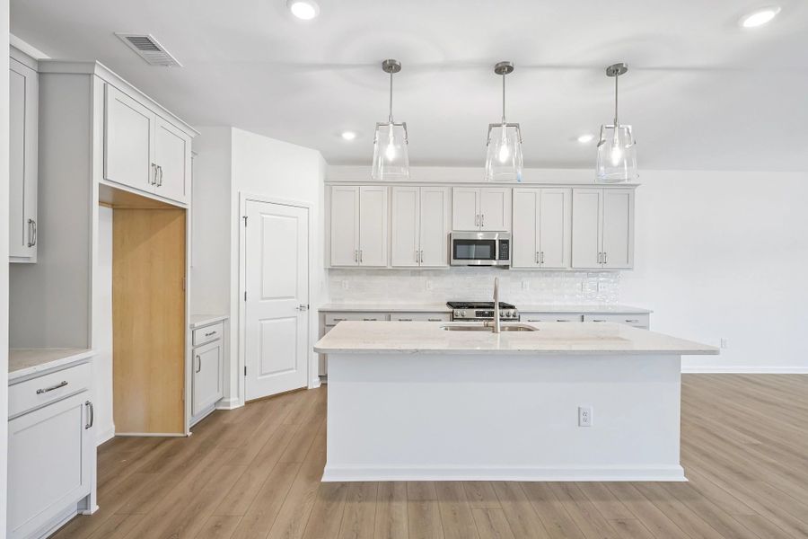 Kitchen featuring the AW Collection® Milan - Chic gray finishes and smooth surfaces shine.