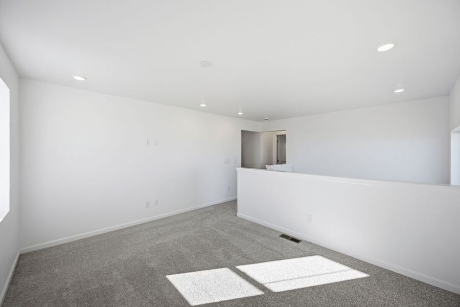 Spacious, unfurnished interior of a new home in Trailstone Town Collection, Arvada (Image 22).