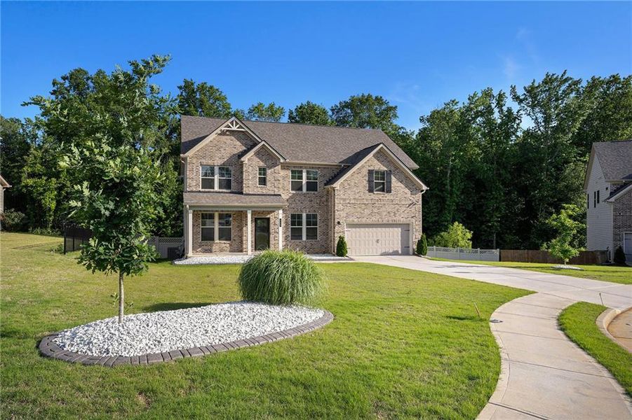 Front exterior of a new home in , Hampton, GA, highlighting curb appeal (Image 1).