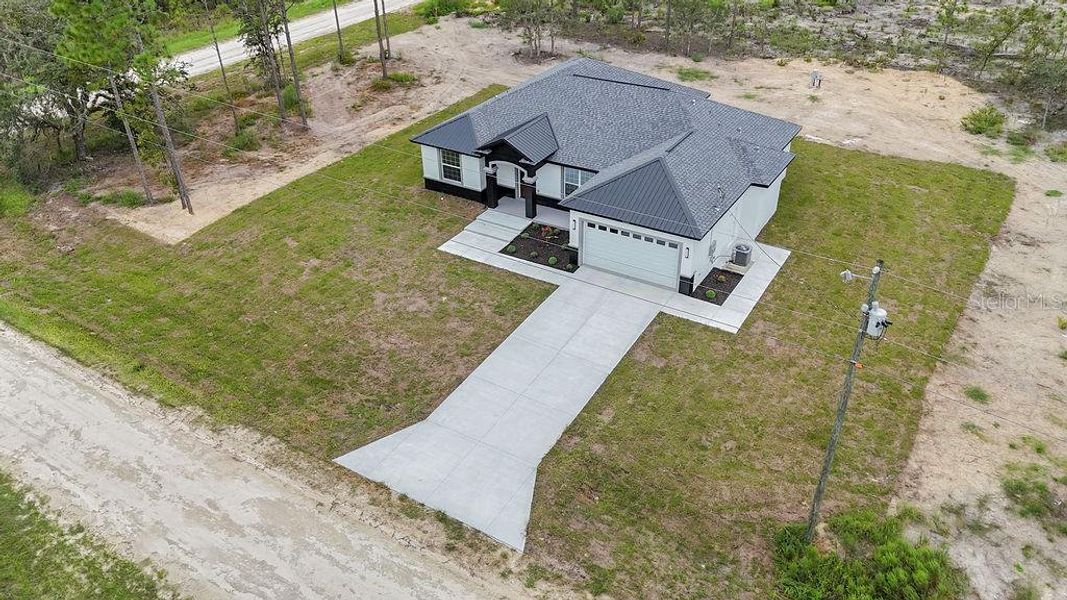 Front exterior of a new home in , Dunnellon, FL, highlighting curb appeal (Image 37). Front exterior of a new home in , Dunnellon, FL, highlighting curb appeal (Image 37).