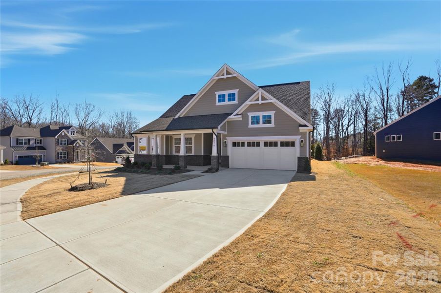 Front exterior of a new home in Rone Creek, Waxhaw, NC, highlighting curb appeal (Image 2). Front exterior of a new home in Rone Creek, Waxhaw, NC, highlighting curb appeal (Image 2).