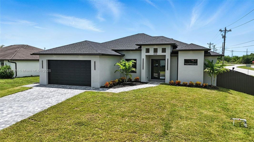 Front exterior of a new home in , Cape Coral, FL, highlighting curb appeal (Image 20). Front exterior of a new home in , Cape Coral, FL, highlighting curb appeal (Image 20).