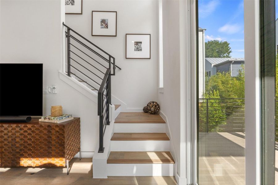 Staircase featuring baseboards