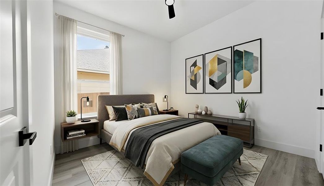 Bedroom featuring light wood-style floors and a ceiling fan
