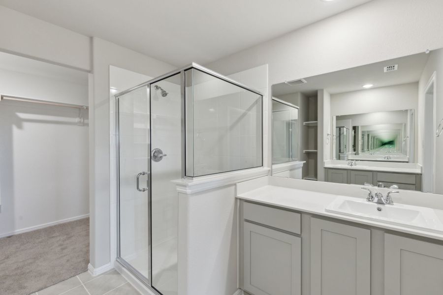 Primary Bathroom in the Harrison home plan by Trophy Signature Homes – REPRESENTATIVE PHOTO