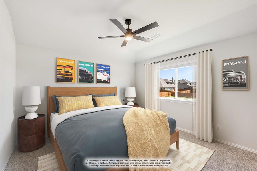 Bedroom with wood-frame bed, ceiling fan, carpet floors, and a window with white curtains Bedroom with wood-frame bed, ceiling fan, carpet floors, and a window with white curtains