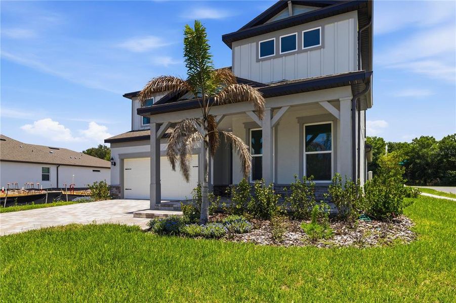 Front exterior of a new home in , Riverview, FL, highlighting curb appeal (Image 25).