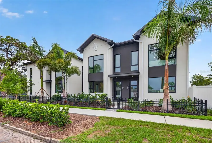 Front exterior of a new home in , St. Petersburg, FL, highlighting curb appeal (Image 1). Front exterior of a new home in , St. Petersburg, FL, highlighting curb appeal (Image 1).