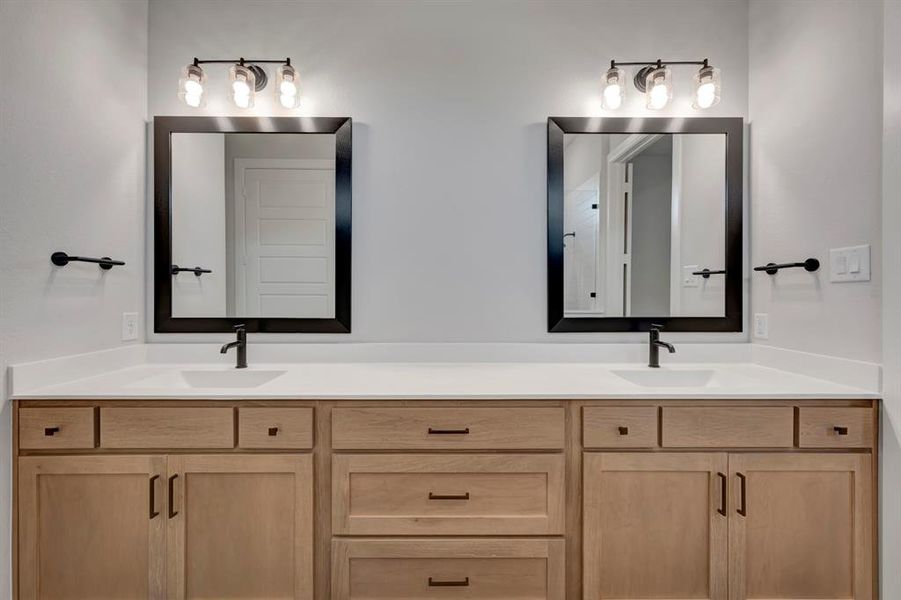 Bathroom featuring double vanity