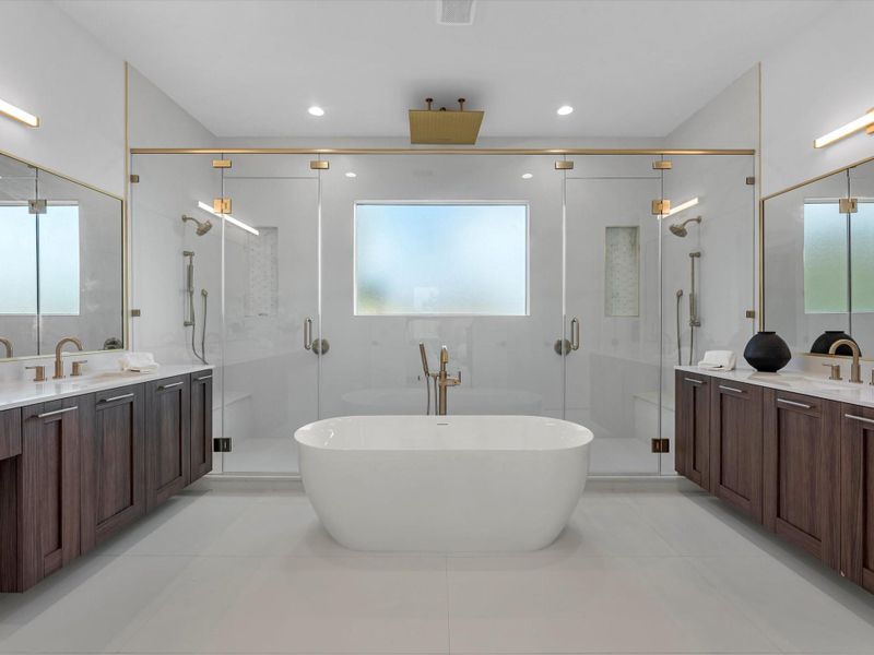 The Primary Bathroom features porcelain tiles for a superior quality feel, generous dual shower heads and rainfall shower; free-standing, soaking tub.